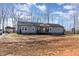 Single-story home with gray siding and a partially landscaped yard at 5724 Walters Ln, Burlington, NC 27217
