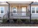 House exterior with wooden porch and steps at 5724 Walters Ln, Burlington, NC 27217