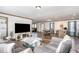 Living room features gray sofas and a built-in electric fireplace at 5724 Walters Ln, Burlington, NC 27217