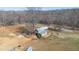 An aerial view of the barn and paddock area of the property at 7700 Circle L Trl, Rougemont, NC 27572