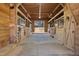 Barn interior with stalls and concrete flooring, designed for the comfort and safety of animals at 7700 Circle L Trl, Rougemont, NC 27572