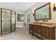 Elegant bathroom with glass-enclosed shower, soaking tub, and ornate vanity at 7700 Circle L Trl, Rougemont, NC 27572