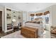 Cozy bedroom with a built-in desk, plush rug, and ample natural light at 7700 Circle L Trl, Rougemont, NC 27572