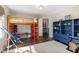 ' room with a bunk bed, telescope, and colorful storage units at 7700 Circle L Trl, Rougemont, NC 27572