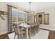 Charming dining room with large window and rustic wood accents and chandelier at 7700 Circle L Trl, Rougemont, NC 27572