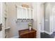 Entryway with cubbies and storage above a rustic wooden chest, offering a convenient organization area at 7700 Circle L Trl, Rougemont, NC 27572