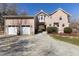 Spacious two-car garage adjacent to the house with an archway connecting the two buildings at 7700 Circle L Trl, Rougemont, NC 27572