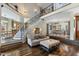 Open-concept living room connects kitchen and dining, features hardwood and staircase at 7700 Circle L Trl, Rougemont, NC 27572