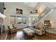 Bright living room with large windows, a cozy fireplace, and hardwood floors at 7700 Circle L Trl, Rougemont, NC 27572