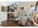 Bright and airy living room with fireplace, large windows, and hardwood floors at 7700 Circle L Trl, Rougemont, NC 27572