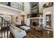 Inviting living room boasts a floor-to-ceiling stone fireplace and wood accent wall at 7700 Circle L Trl, Rougemont, NC 27572
