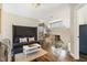 A cozy loft with a large sectional sofa and wrought iron railing at 7700 Circle L Trl, Rougemont, NC 27572