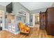 Bedroom boasts hardwood floors, a sitting nook, and barn door access to the bathroom at 7700 Circle L Trl, Rougemont, NC 27572