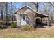 Small storage shed with an overhang, ideal for storing tools and garden supplies at 7700 Circle L Trl, Rougemont, NC 27572