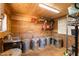 Wash room with a sink, metal trash cans, and storage shelves, convenient for cleaning and maintenance at 7700 Circle L Trl, Rougemont, NC 27572