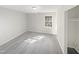 Bright bedroom featuring a large window and light colored walls at 1 Druid Pl, Durham, NC 27707