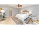 Bedroom with queen bed, two nightstands, and seating area at 107 Coatbridge Cir, Cary, NC 27511