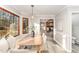 Bright dining area with built-in bench seating and view to living room at 107 Coatbridge Cir, Cary, NC 27511