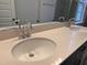 Bathroom featuring double sinks with modern fixtures and a neutral-toned countertop at 107 White Oak Garden Way # 49, Garner, NC 27529