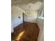 Hardwood floors and a crystal chandelier highlight this dining room at 1100 Hadley Rd, Raleigh, NC 27610