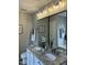 Elegant bathroom with granite double vanity and updated light fixtures at 1211 Canyon Rock Ct # 111, Raleigh, NC 27610