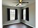 Spacious bedroom with dark hardwood floors and two large windows at 1211 Canyon Rock Ct # 111, Raleigh, NC 27610