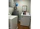 Convenient laundry room with washer, dryer, and utility sink at 1211 Canyon Rock Ct # 111, Raleigh, NC 27610