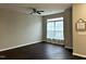 Spacious living room with dark hardwood floors and ceiling fan at 1211 Canyon Rock Ct # 111, Raleigh, NC 27610