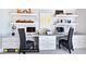 Spacious home office with built-in shelving and two workstations at 127 Preston Trce, Pittsboro, NC 27312