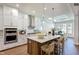 Spacious kitchen with island, stainless steel appliances, and white cabinets at 127 Preston Trce, Pittsboro, NC 27312