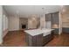 Modern kitchen with marble countertops and farmhouse sink at 127 Preston Trce, Pittsboro, NC 27312