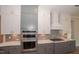 Modern kitchen with gray cabinetry and double oven at 127 Preston Trce, Pittsboro, NC 27312