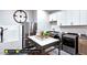 Spacious laundry room with white cabinets, a sink, and a built-in dog shower at 127 Preston Trce, Pittsboro, NC 27312