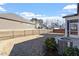 Fenced backyard with patio and view of neighboring homes at 12408 Angel Vale Pl, Durham, NC 27703