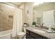 Charming bathroom features granite countertops, tile floors, and shower-tub combo at 12408 Angel Vale Pl, Durham, NC 27703