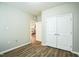 Clean and spacious bedroom with hardwood floors and neutral color palette at 12408 Angel Vale Pl, Durham, NC 27703