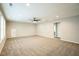 Large bonus room boasts plush carpeting, recessed lighting, and a ceiling fan at 12408 Angel Vale Pl, Durham, NC 27703