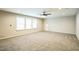 Large bonus room features carpet, ceiling fan, recessed lighting and ample natural light at 12408 Angel Vale Pl, Durham, NC 27703