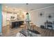 Well-lit kitchen featuring granite countertops, stainless steel appliances, and an open design concept at 12408 Angel Vale Pl, Durham, NC 27703