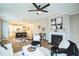 Open concept living room featuring modern decor, fireplace and easy access to the kitchen at 12408 Angel Vale Pl, Durham, NC 27703