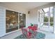 Cozy screened porch with a colorful rug, a small table, and chairs perfect for outdoor relaxation at 12408 Angel Vale Pl, Durham, NC 27703