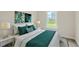 Charming bedroom with a comfy bed, teal bedding, and a window with a view at 1318 Hazelnut Ridge Ln, Knightdale, NC 27545