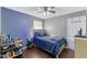 Cozy bedroom with wood flooring and ceiling fan at 1508 Carroll Heights Rd, Zebulon, NC 27597