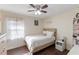 Well-lit bedroom with wood flooring and ceiling fan at 1508 Carroll Heights Rd, Zebulon, NC 27597