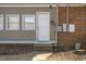 Rear exterior view showing access door and utilities at 1508 Carroll Heights Rd, Zebulon, NC 27597