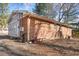 Side view of the house showcasing brick and siding at 1508 Carroll Heights Rd, Zebulon, NC 27597