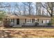 House exterior featuring a neutral color palette and well-maintained landscaping at 1508 Carroll Heights Rd, Zebulon, NC 27597
