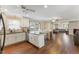 Open kitchen features island, hardwood floors, and stainless steel appliances at 1508 Carroll Heights Rd, Zebulon, NC 27597