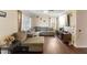 Living room featuring an L-shaped sofa and large-screen TV at 1508 Carroll Heights Rd, Zebulon, NC 27597