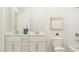 Modern bathroom with double vanity and bathtub at 1561 Goldfinch Perch Ln # 352, Knightdale, NC 27545